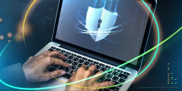 hands typing on a laptop with security shield 2026 01 07 23 24 09 utc