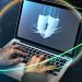 hands typing on a laptop with security shield 2026 01 07 23 24 09 utc